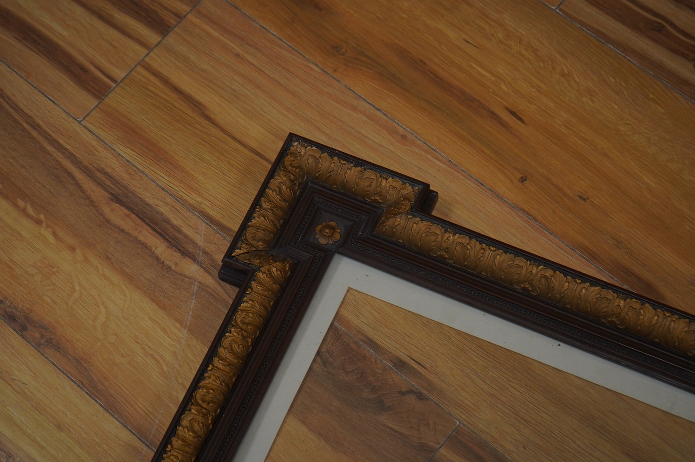 Two decorative partially gilt French picture frames, one housing a colour print, largest overall 58 x 49cm. Condition - good